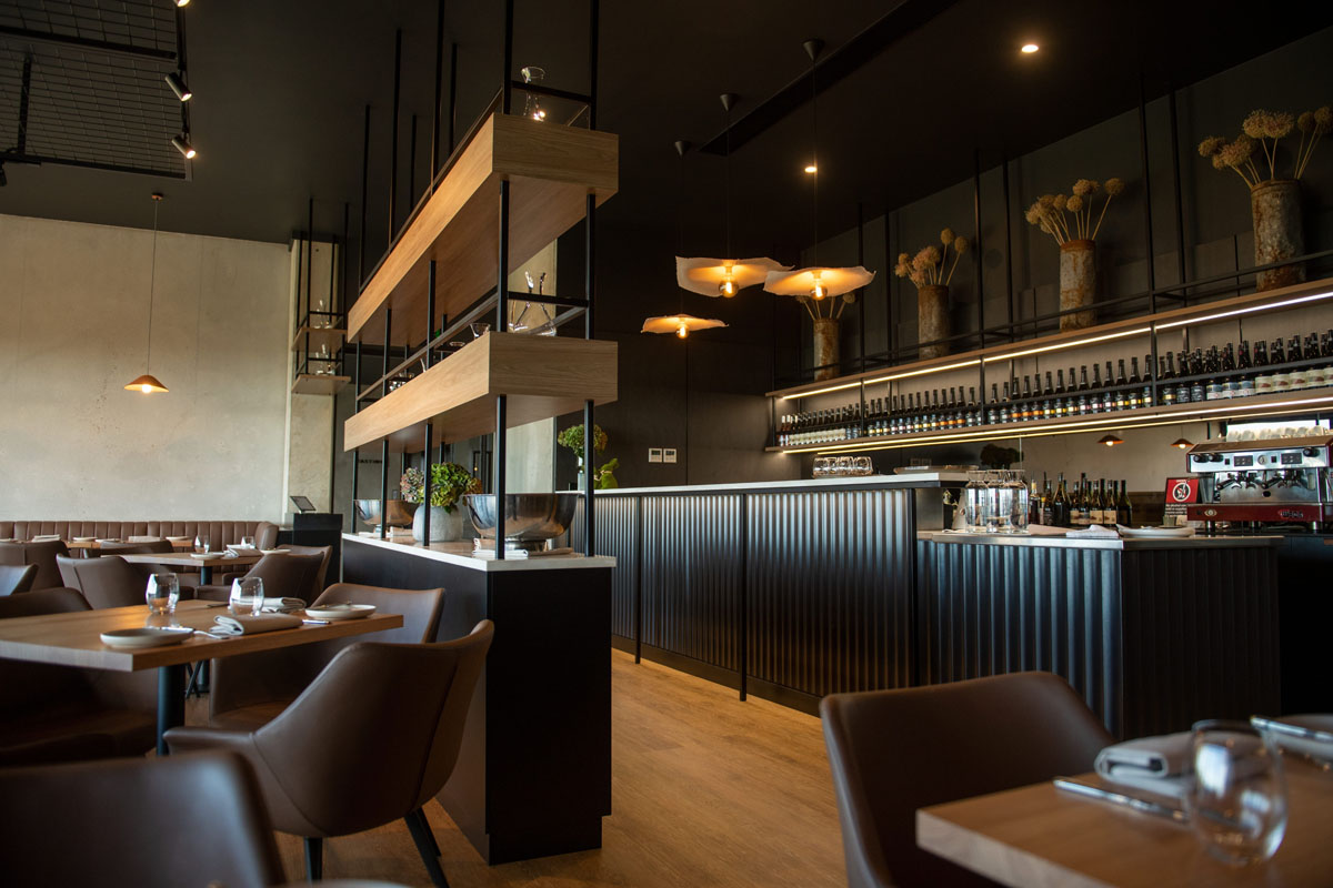 Modern stylish restaurant interior with wooden accents and warm lighting